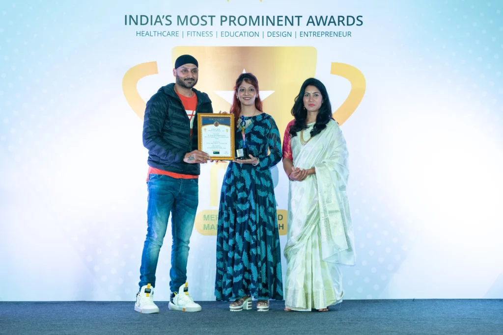 Pooja Jainn from Digits N Destini awarded by Legendary Cricketer Harbhajan Singh and Merits Awards as India's best numerologist in New Born Baby Names and Sports Numerology